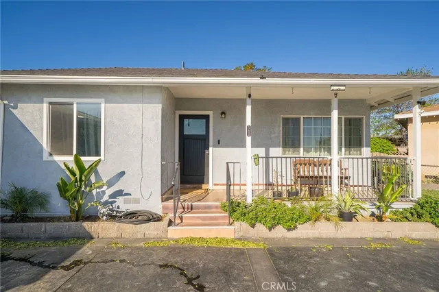 front view of a house with a small yard