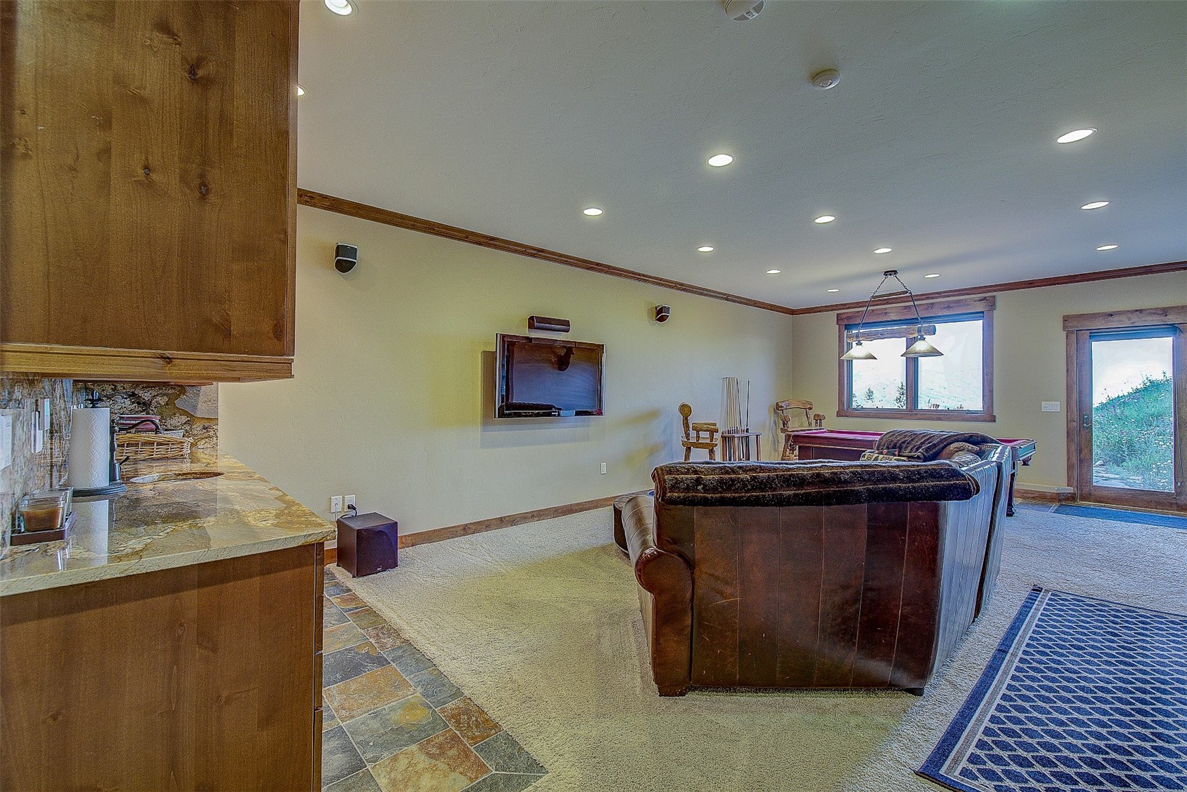 59 Club House Road, Unit C Breckenridge, CO 80424 - Photo 18 of 50 Living room with light carpet, recessed lighting, stone tile floors, and ornamental molding