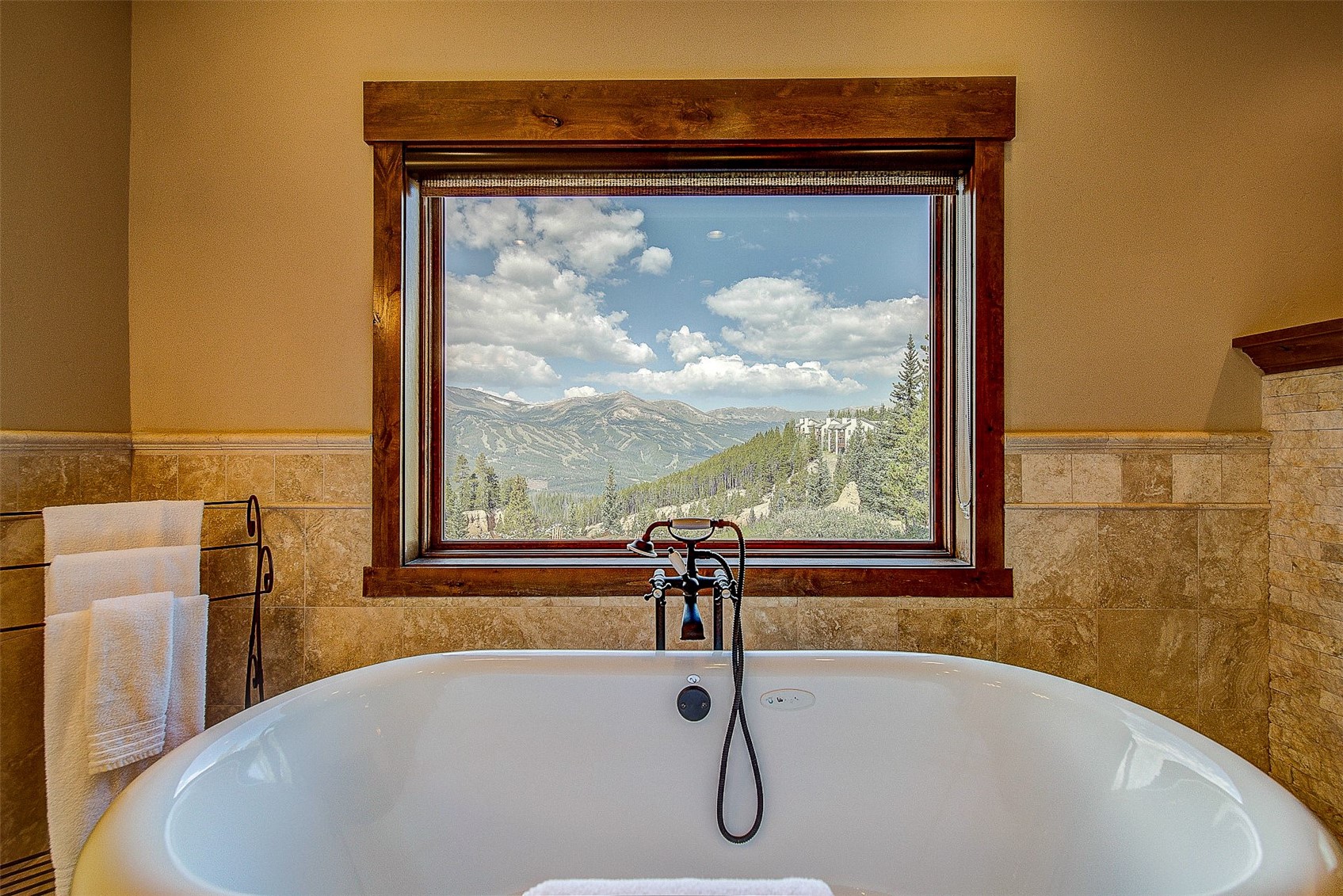 59 Club House Road, Unit C Breckenridge, CO 80424 - Photo 22 of 50 Full bathroom with a soaking tub and a mountain view