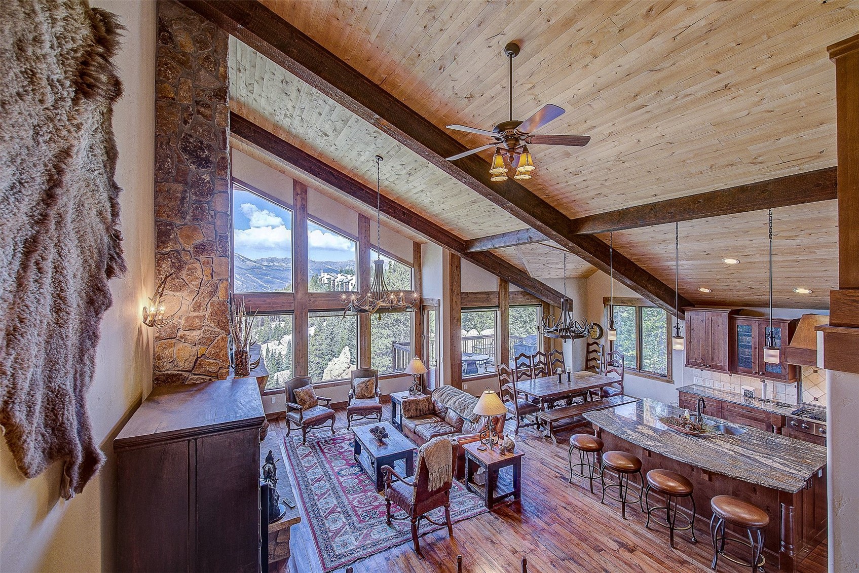 59 Club House Road, Unit C Breckenridge, CO 80424 - Photo 29 of 50 Living area featuring beamed ceiling, ceiling fan, light wood-style flooring, a chandelier, and high vaulted ceiling