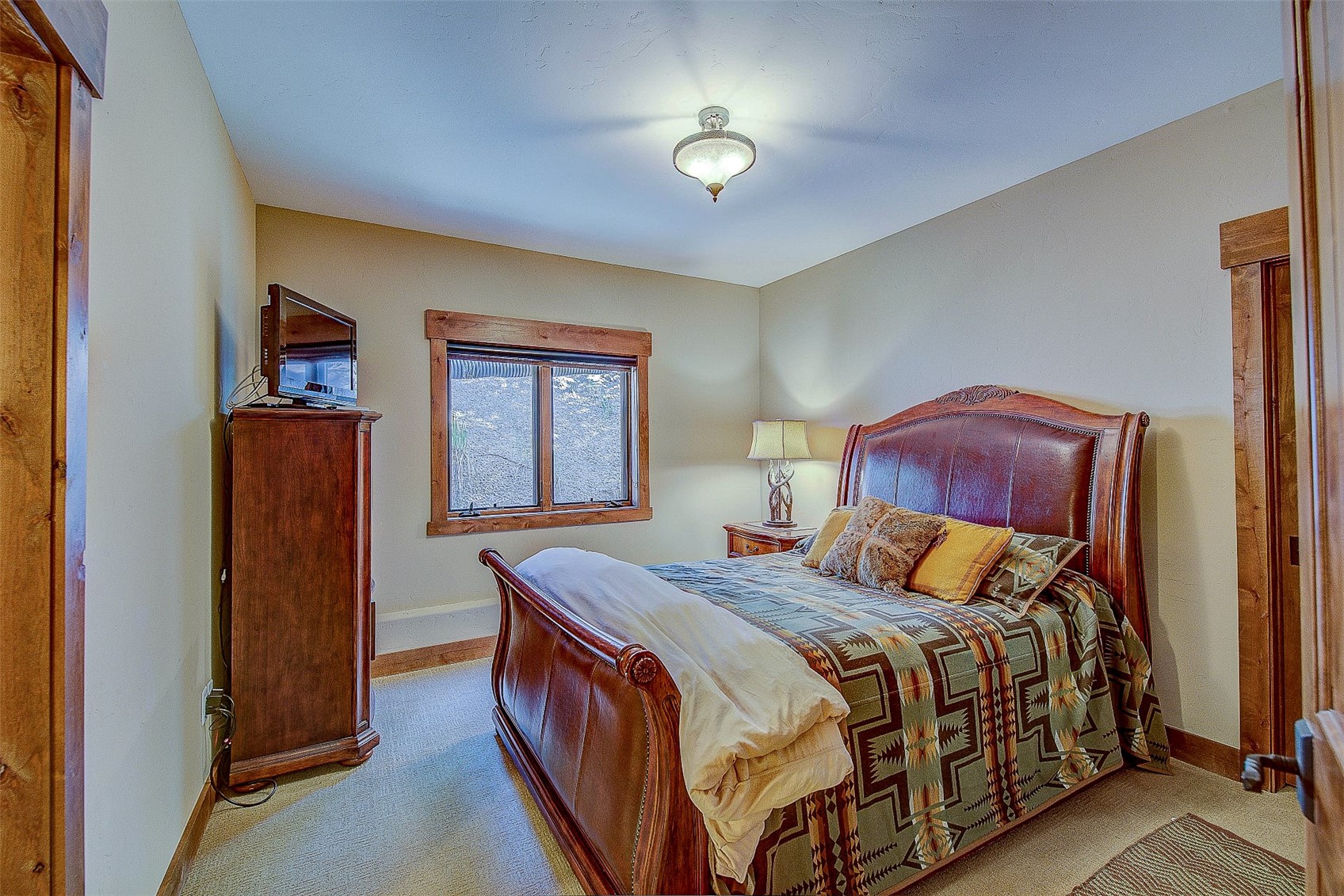 59 Club House Road, Unit C Breckenridge, CO 80424 - Photo 30 of 50 Bedroom featuring baseboards and light carpet
