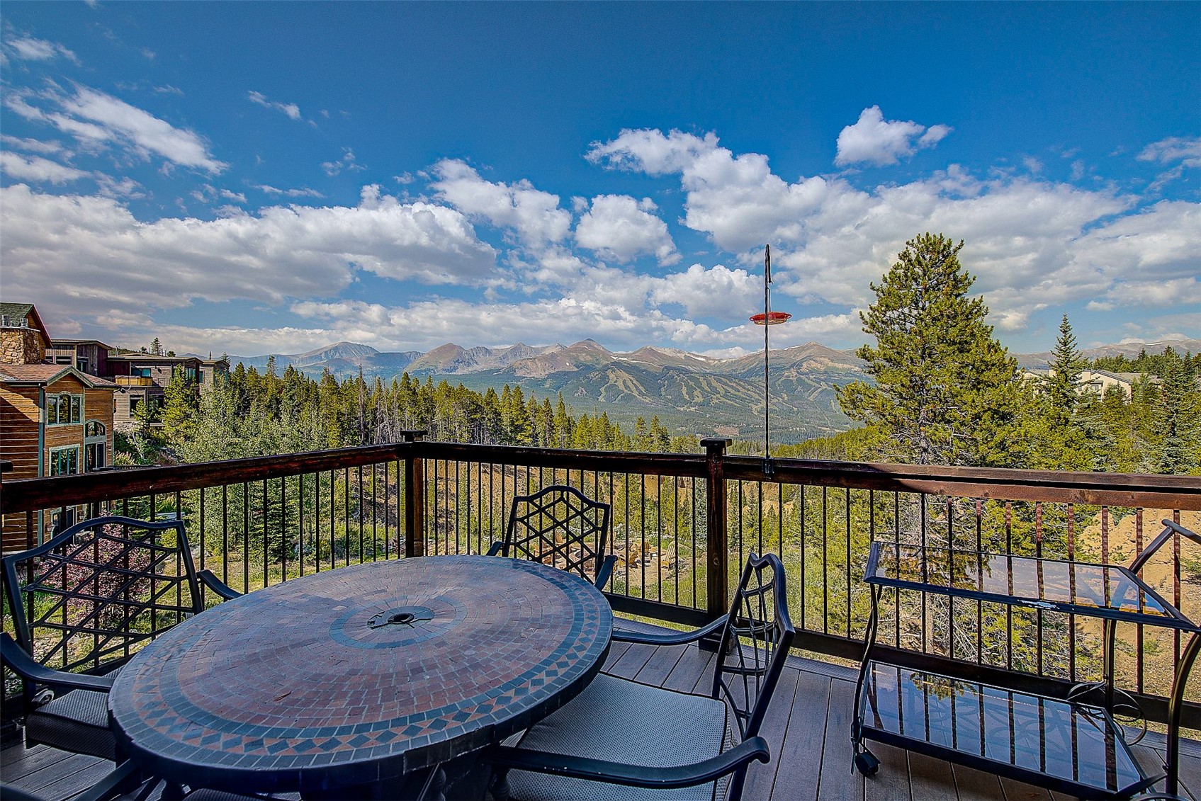 59 Club House Road, Unit C Breckenridge, CO 80424 - Photo 9 of 50 Wooden terrace featuring outdoor dining space and a mountain view