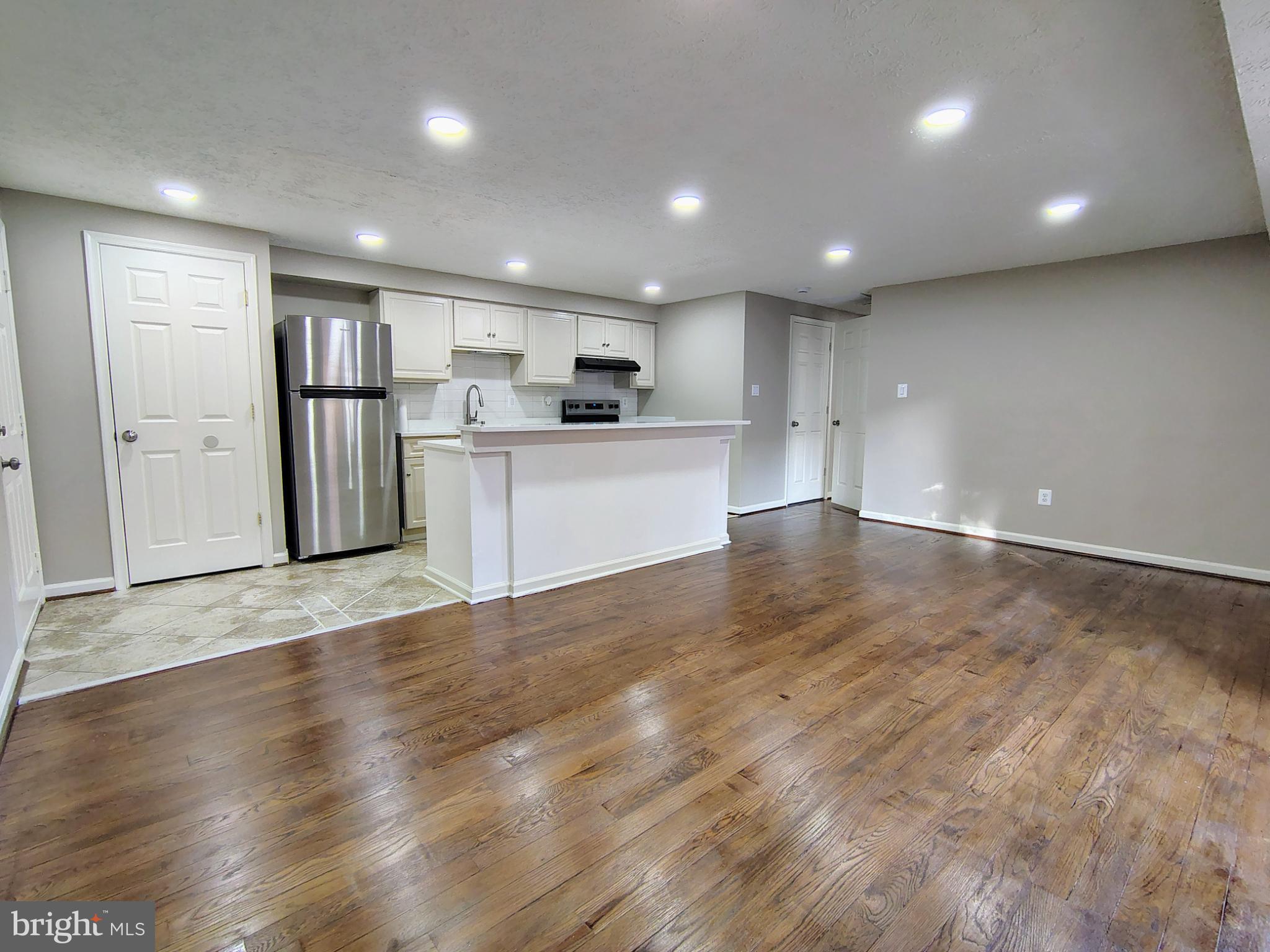 12407 Hickory Tree Way, Unit H 524 Germantown, MD 20874 - Photo 3 of 16 Modern open space with sleek finishes.