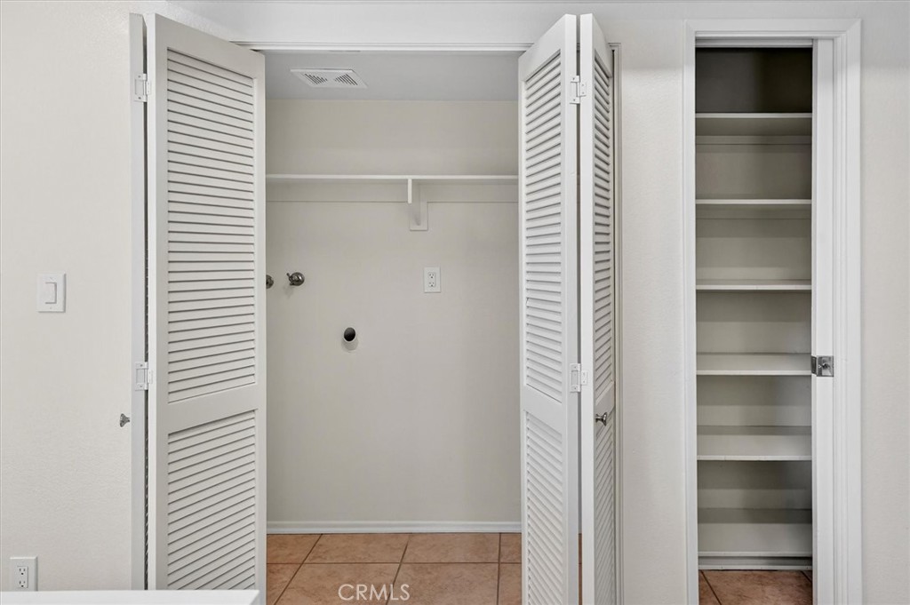 14344 Foothill Boulevard, Unit 1004 Sylmar, CA 91342 - Photo 12 of 27 a view of walk in closet with empty racks
