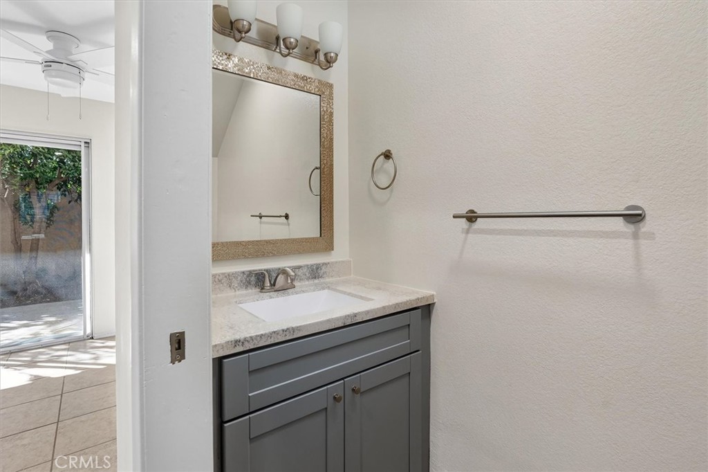 14344 Foothill Boulevard, Unit 1004 Sylmar, CA 91342 - Photo 13 of 27 a bathroom with a sink vanity and a mirror