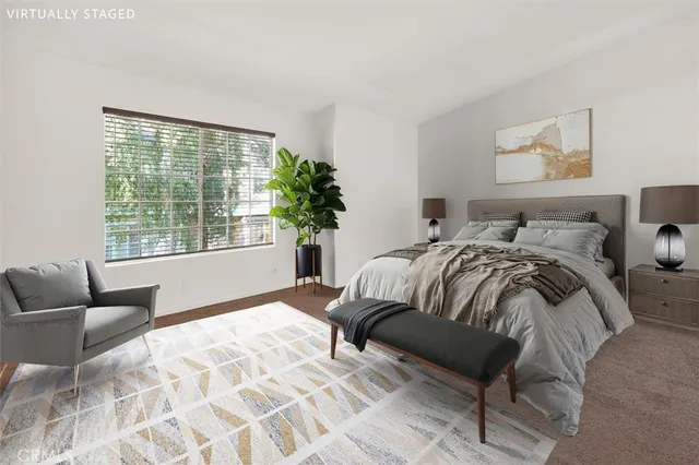 a bedroom with a bed and a couch