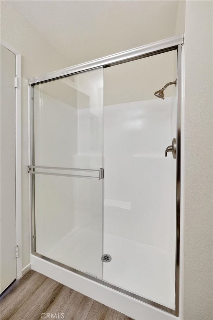 14344 Foothill Boulevard, Unit 1004 Sylmar, CA 91342 - Photo 18 of 27 a bathroom with a glass shower door