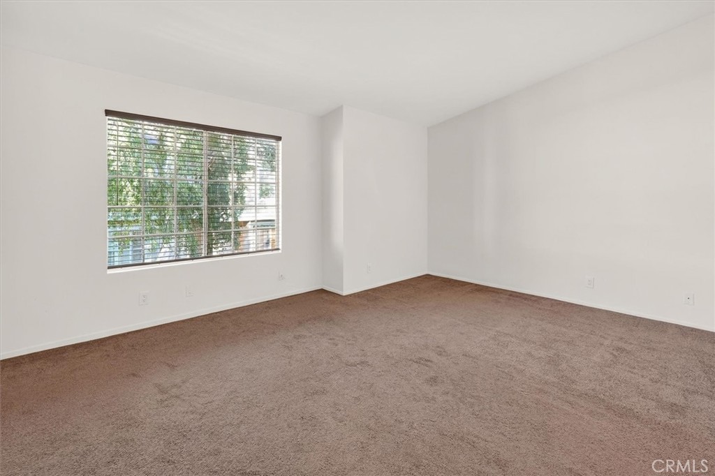 14344 Foothill Boulevard, Unit 1004 Sylmar, CA 91342 - Photo 19 of 27 an empty room with a window