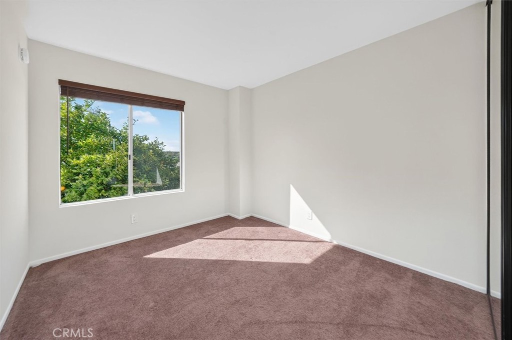 14344 Foothill Boulevard, Unit 1004 Sylmar, CA 91342 - Photo 21 of 27 an empty room with windows