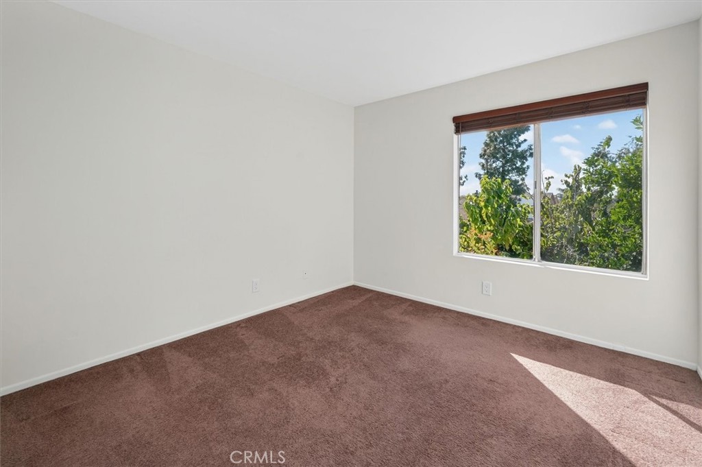 14344 Foothill Boulevard, Unit 1004 Sylmar, CA 91342 - Photo 23 of 27 an empty room with a window