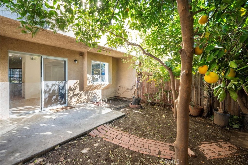 14344 Foothill Boulevard, Unit 1004 Sylmar, CA 91342 - Photo 25 of 27 a view of a house with chairs in the patio