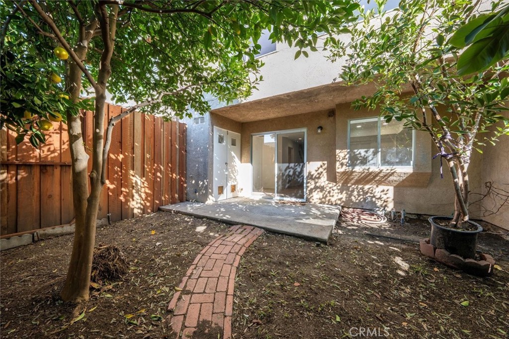 14344 Foothill Boulevard, Unit 1004 Sylmar, CA 91342 - Photo 26 of 27 a view of a house with backyard and sitting area