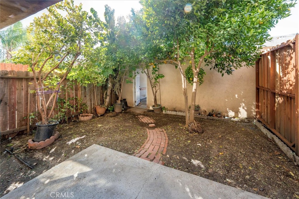 14344 Foothill Boulevard, Unit 1004 Sylmar, CA 91342 - Photo 27 of 27 a backyard of a house with barbeque oven