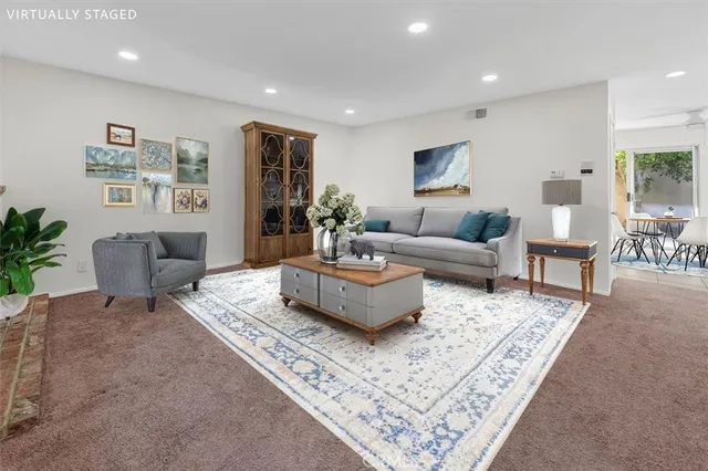 a living room with furniture and a rug