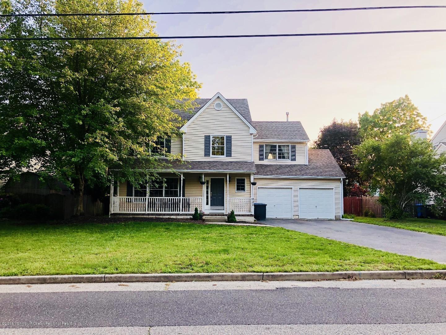220 Schooner Road Manahawkin, NJ 08050 - Photo 1 of 25 a view of a house with a garden and yard