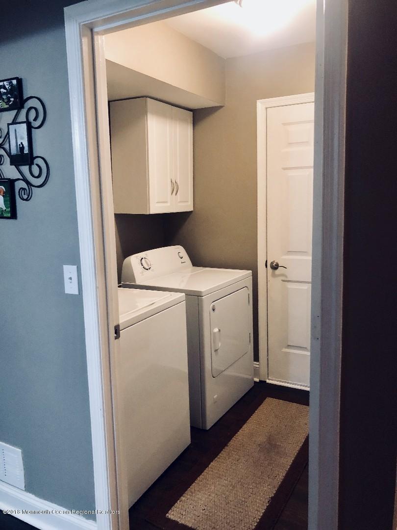 220 Schooner Road Manahawkin, NJ 08050 - Photo 14 of 25 a utility room with dryer and washer