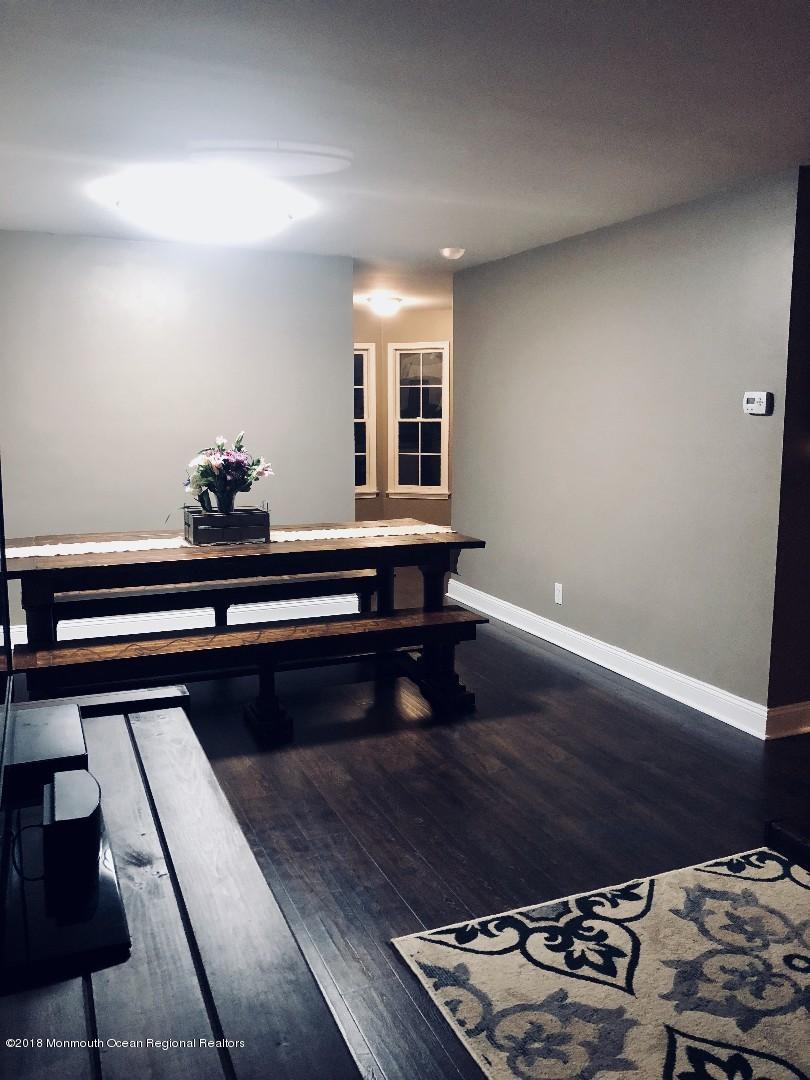 220 Schooner Road Manahawkin, NJ 08050 - Photo 20 of 25 a living room with wooden floor and furniture