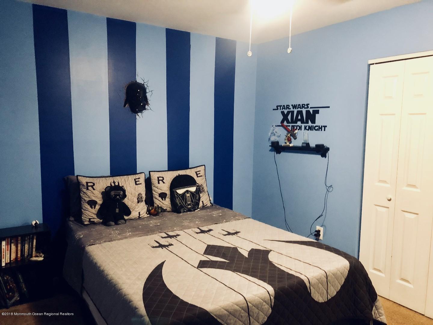 220 Schooner Road Manahawkin, NJ 08050 - Photo 6 of 25 a bedroom with a bed and a window
