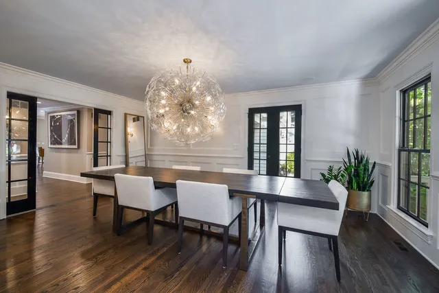 a kitchen with stainless steel appliances kitchen island granite countertop a stove and a sink
