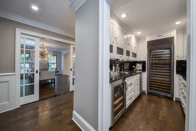 a kitchen with stainless steel appliances sink stove and cabinets