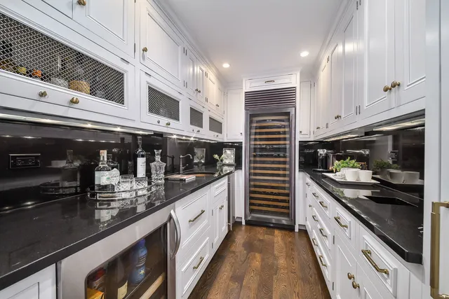 a kitchen with granite countertop a stove and a sink