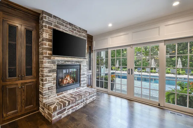 a view of staircase with wooden floor and fan