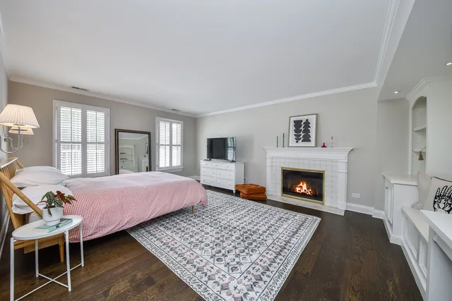 a view of a swimming pool and lounge chairs in back yard of the house
