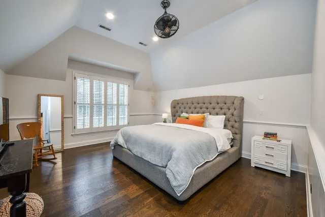 a view of a house with a big yard and potted plants