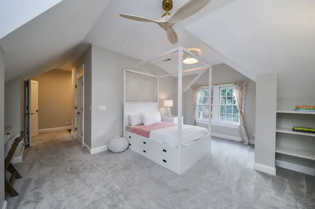 an aerial view of a house with a yard basket ball court and outdoor seating