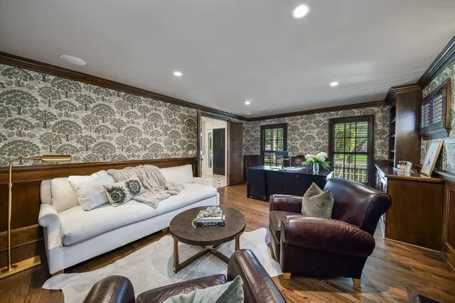 a kitchen with stainless steel appliances kitchen island granite countertop a refrigerator and a stove top oven