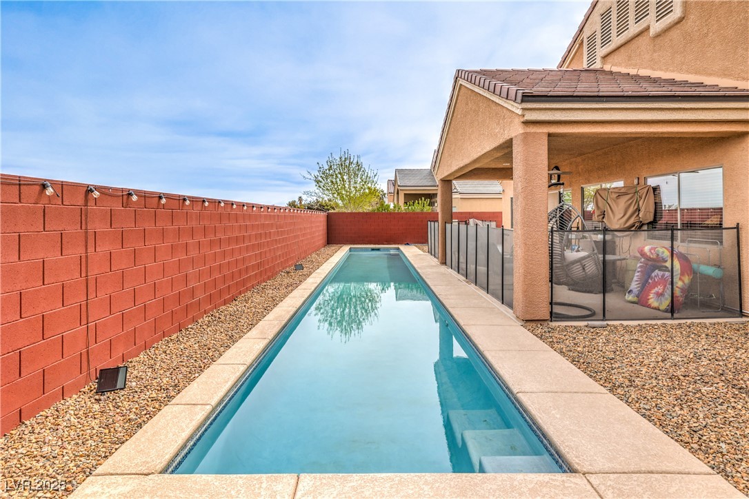 172 Turtle Ridge Avenue Las Vegas, NV 89183 - Photo 34 of 38 View of pool featuring a fenced backyard, a patio, and a fenced in pool