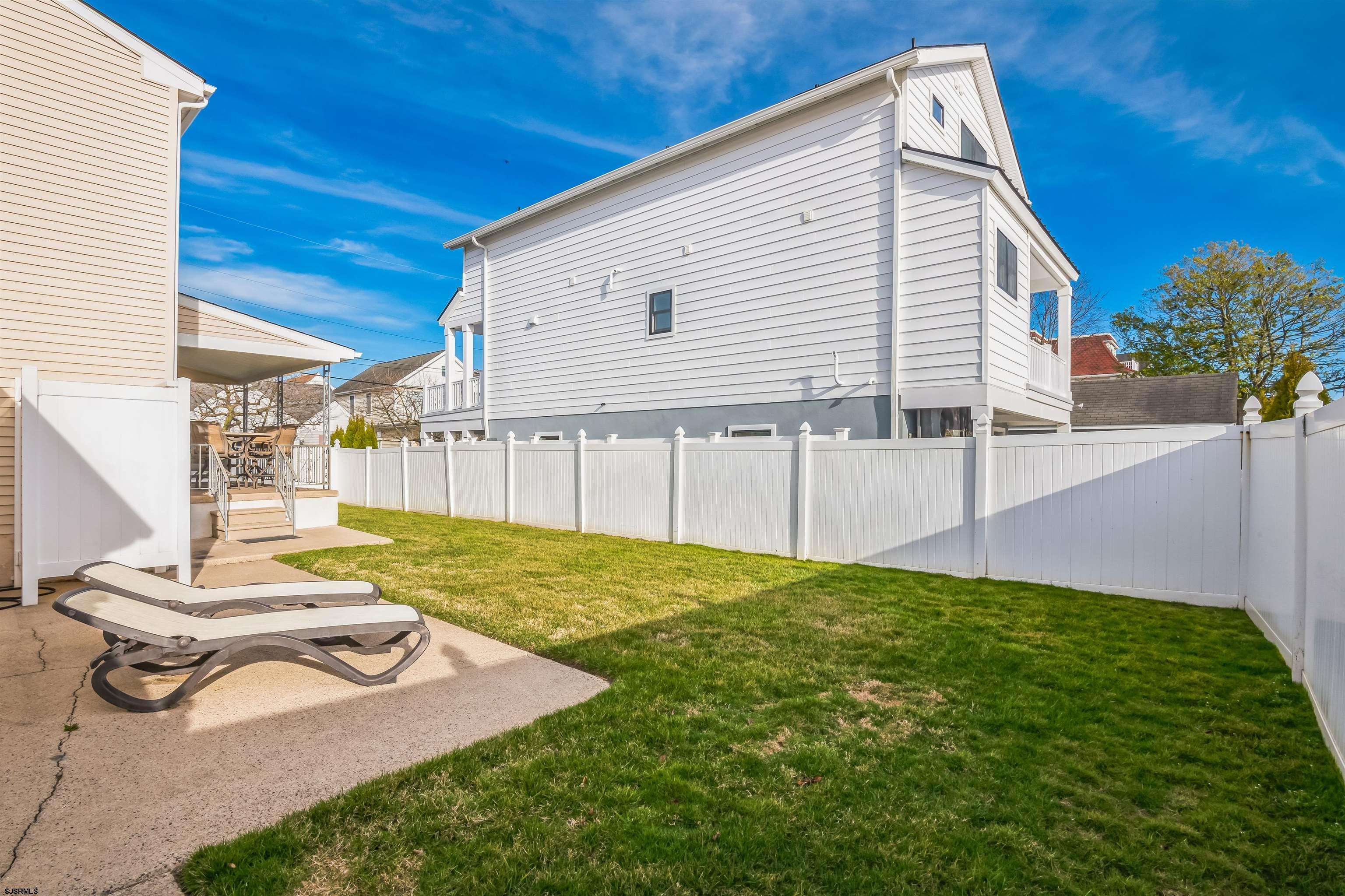 3304 Monmouth Avenue, Unit WINTER RENTAL Longport, NJ 08403 - Photo 27 of 29 a view of a backyard with sitting area
