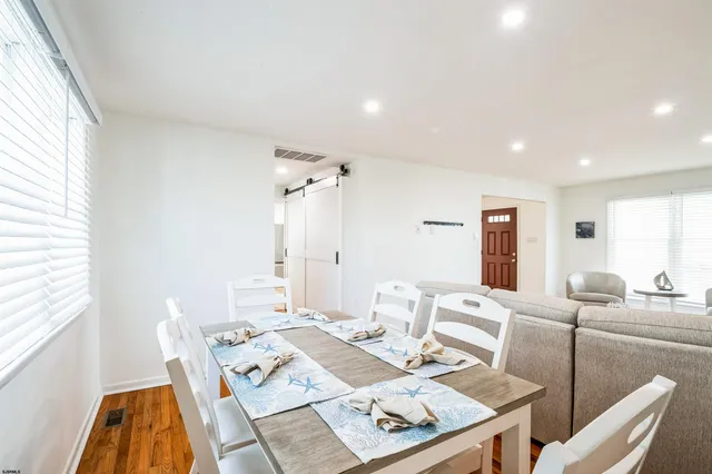 a living room with furniture and next to a window