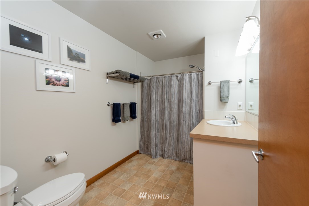 910 Gladstone Street, Unit 309 Bellingham, WA 98229 - Photo 11 of 25 a bathroom with a sink a toilet and shower