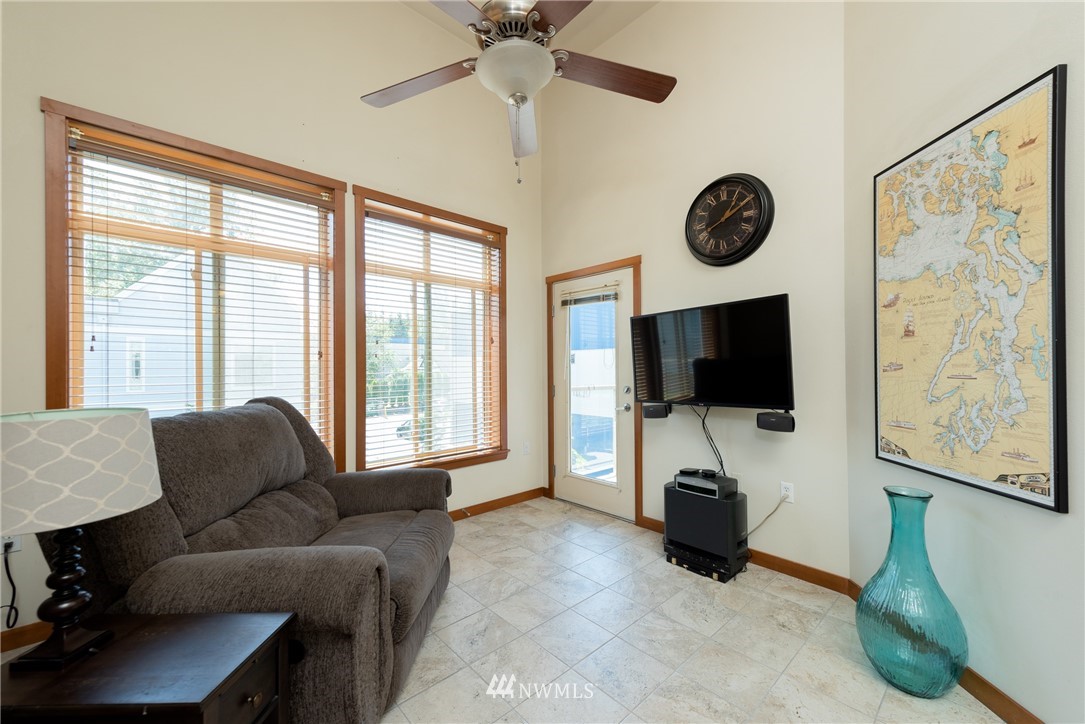 910 Gladstone Street, Unit 309 Bellingham, WA 98229 - Photo 3 of 25 a living room with furniture and a flat screen tv
