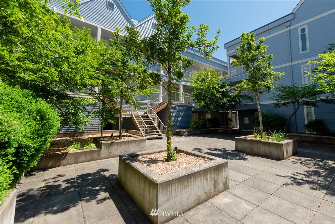 910 Gladstone Street, Unit 309 Bellingham, WA 98229 - Photo 25 of 25 a view of a backyard with plants and chairs
