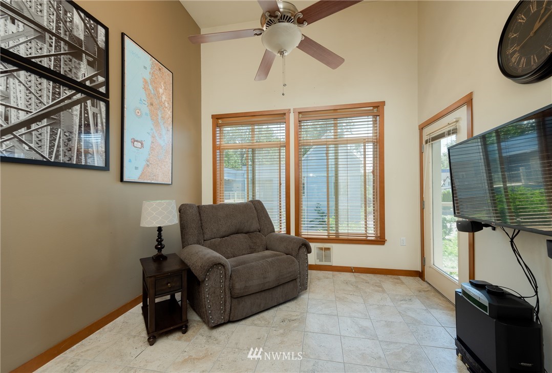 910 Gladstone Street, Unit 309 Bellingham, WA 98229 - Photo 4 of 25 a living room with furniture and a flat screen tv