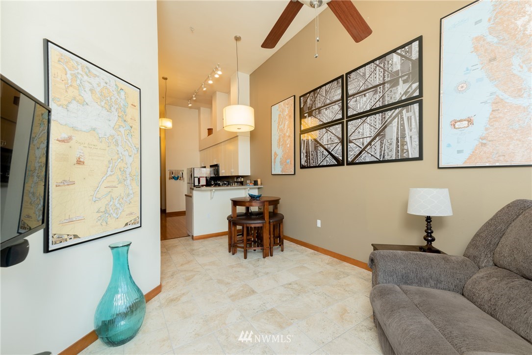 910 Gladstone Street, Unit 309 Bellingham, WA 98229 - Photo 5 of 25 a living room with furniture and a flat screen tv