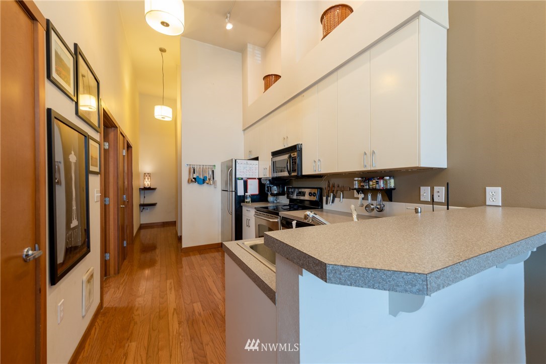 910 Gladstone Street, Unit 309 Bellingham, WA 98229 - Photo 8 of 25 a kitchen with a sink appliances and cabinets