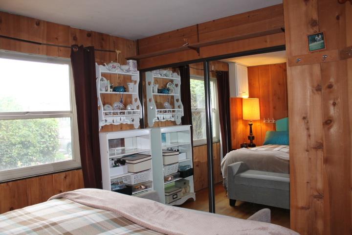 10433 Rockingham Drive Rancho Cordova, CA 95670 - Photo 18 of 34 a bedroom with a bed and a window