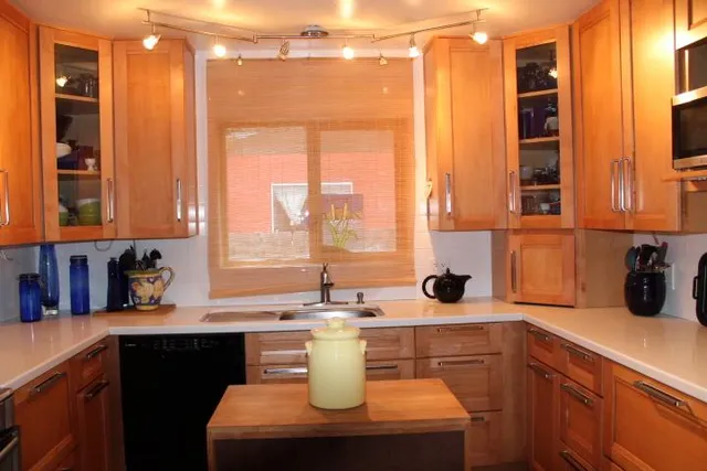 a kitchen with a sink and a window