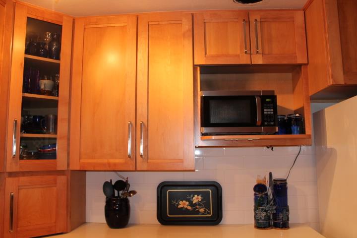10433 Rockingham Drive Rancho Cordova, CA 95670 - Photo 7 of 34 a kitchen with a refrigerator and cabinets