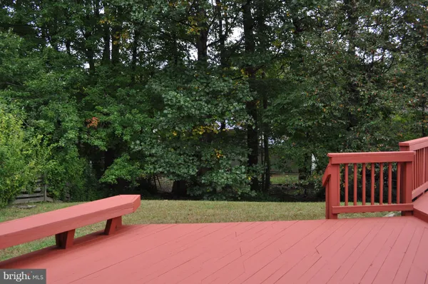 a view of a balcony with wooden floor