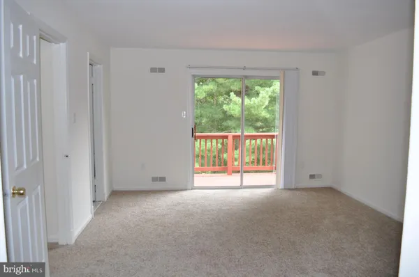 a view of a hallway with a white walls