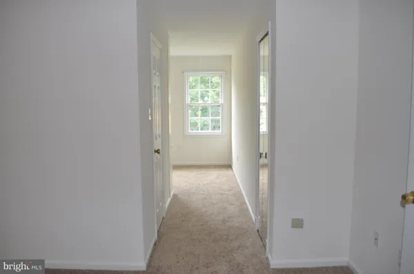 a bathroom with a granite countertop sink a mirror and a shower