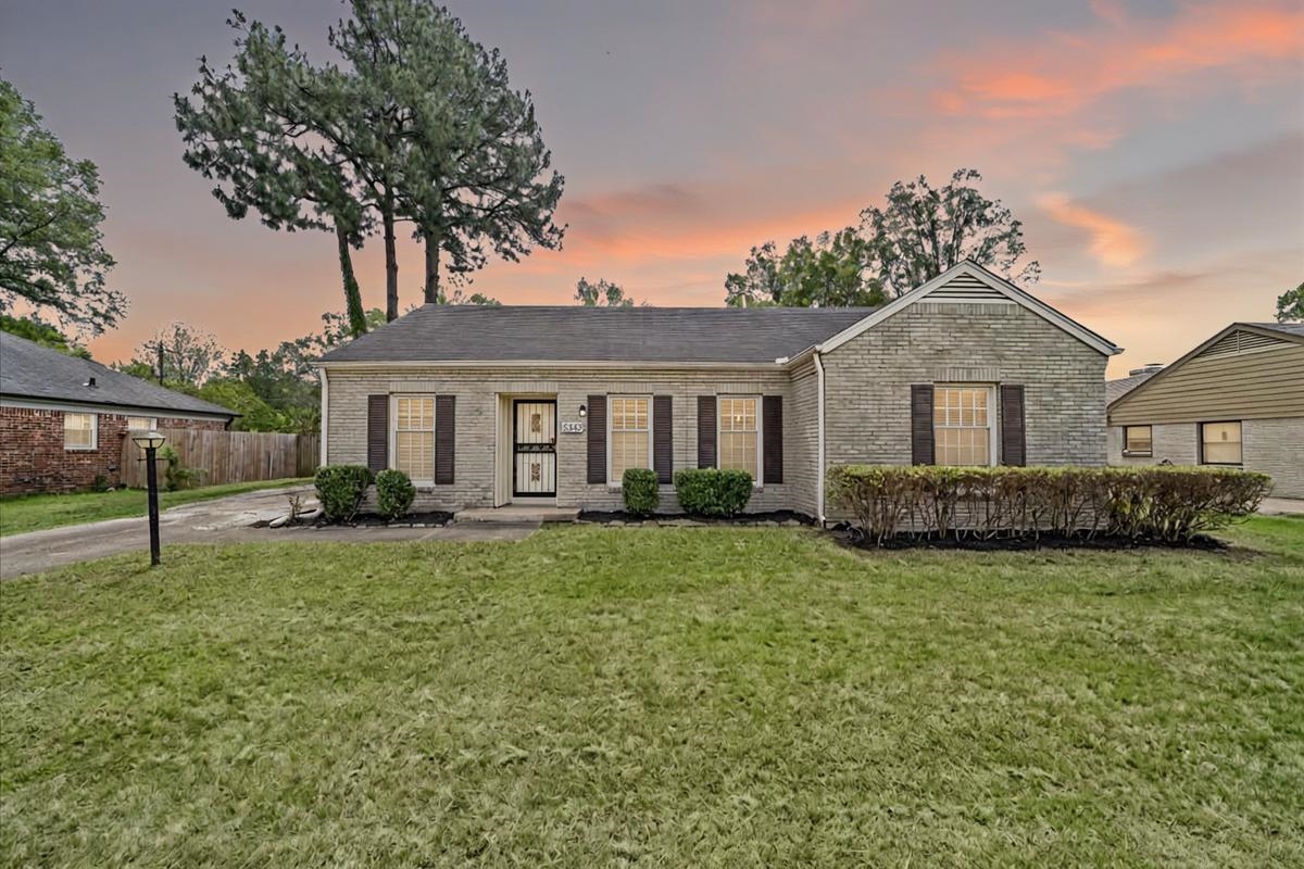 5343 Quince Road Memphis, TN 38119 - Photo 1 of 33 a front view of a house with a yard