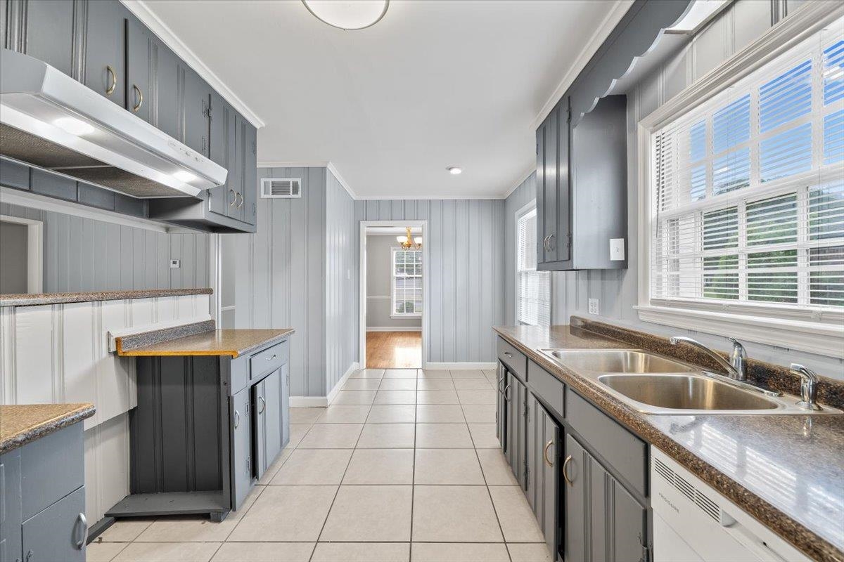 5343 Quince Road Memphis, TN 38119 - Photo 15 of 33 a kitchen with granite countertop a sink and a stove