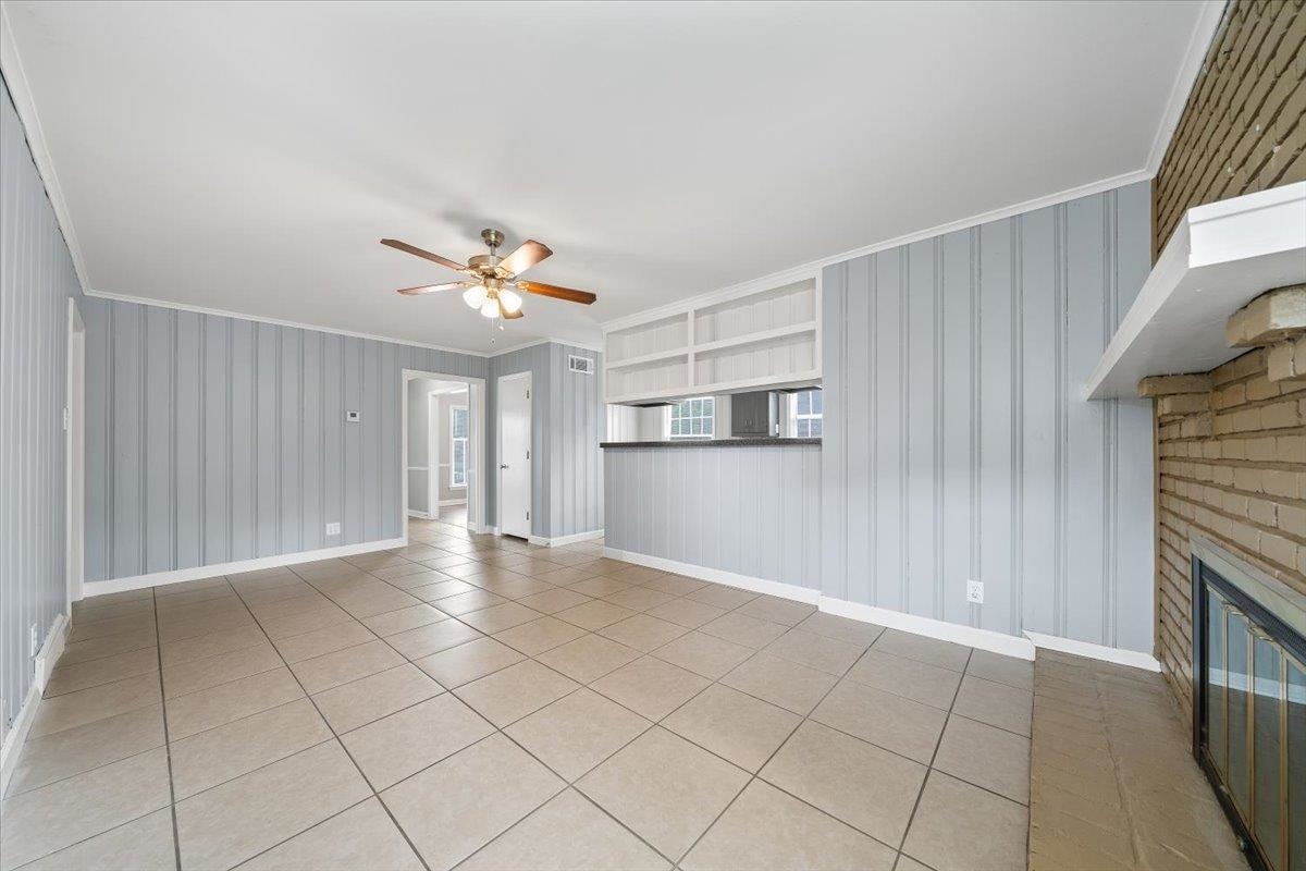 5343 Quince Road Memphis, TN 38119 - Photo 17 of 33 a view of a livingroom with a ceiling fan and window