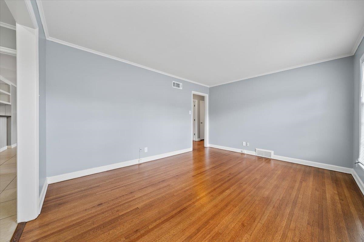 5343 Quince Road Memphis, TN 38119 - Photo 19 of 33 a view of an empty room with wooden and a window