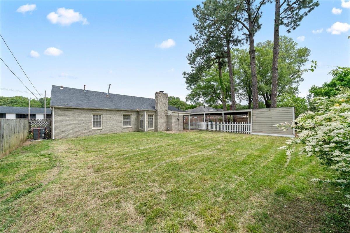 5343 Quince Road Memphis, TN 38119 - Photo 26 of 33 a front view of a house with a garden